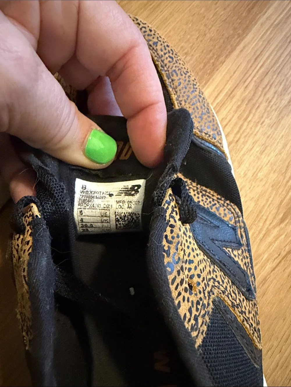 New Balance women’s Black and Tan Leopard-Print Sneakers